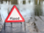  A flood sign on a flooded road  