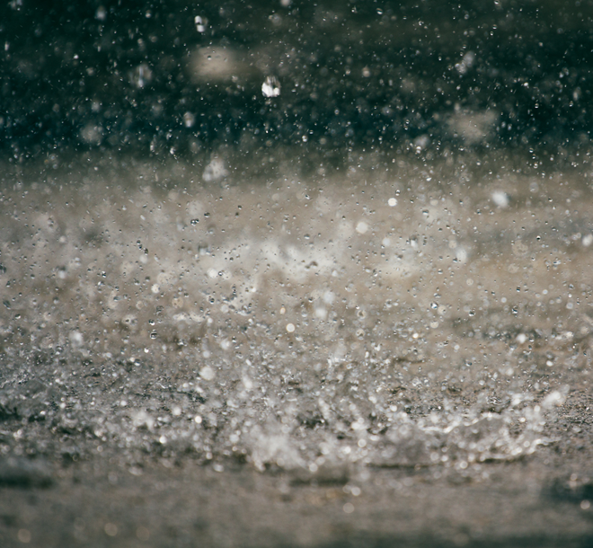 Rainwater falling on the ground heavily