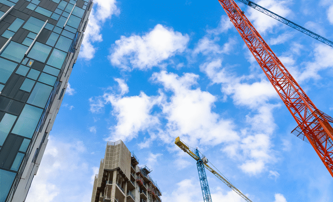 A crane and construction occurring on a building site