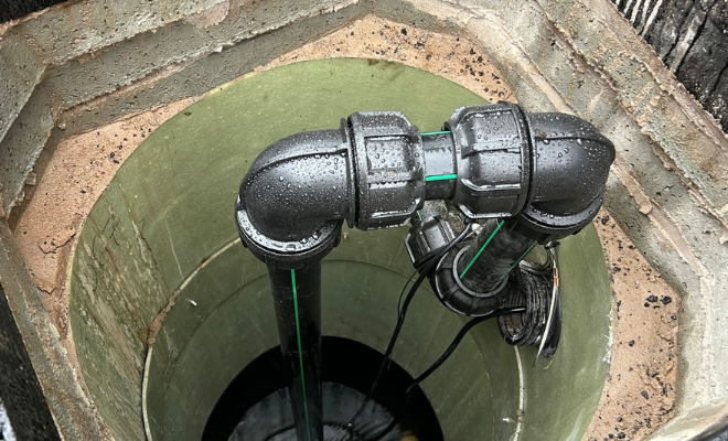 an image showing the underground tank access turrett on a rainwater harvesting system. It shows the pipework raised at the correct level, ensuring a safe working level for servicing